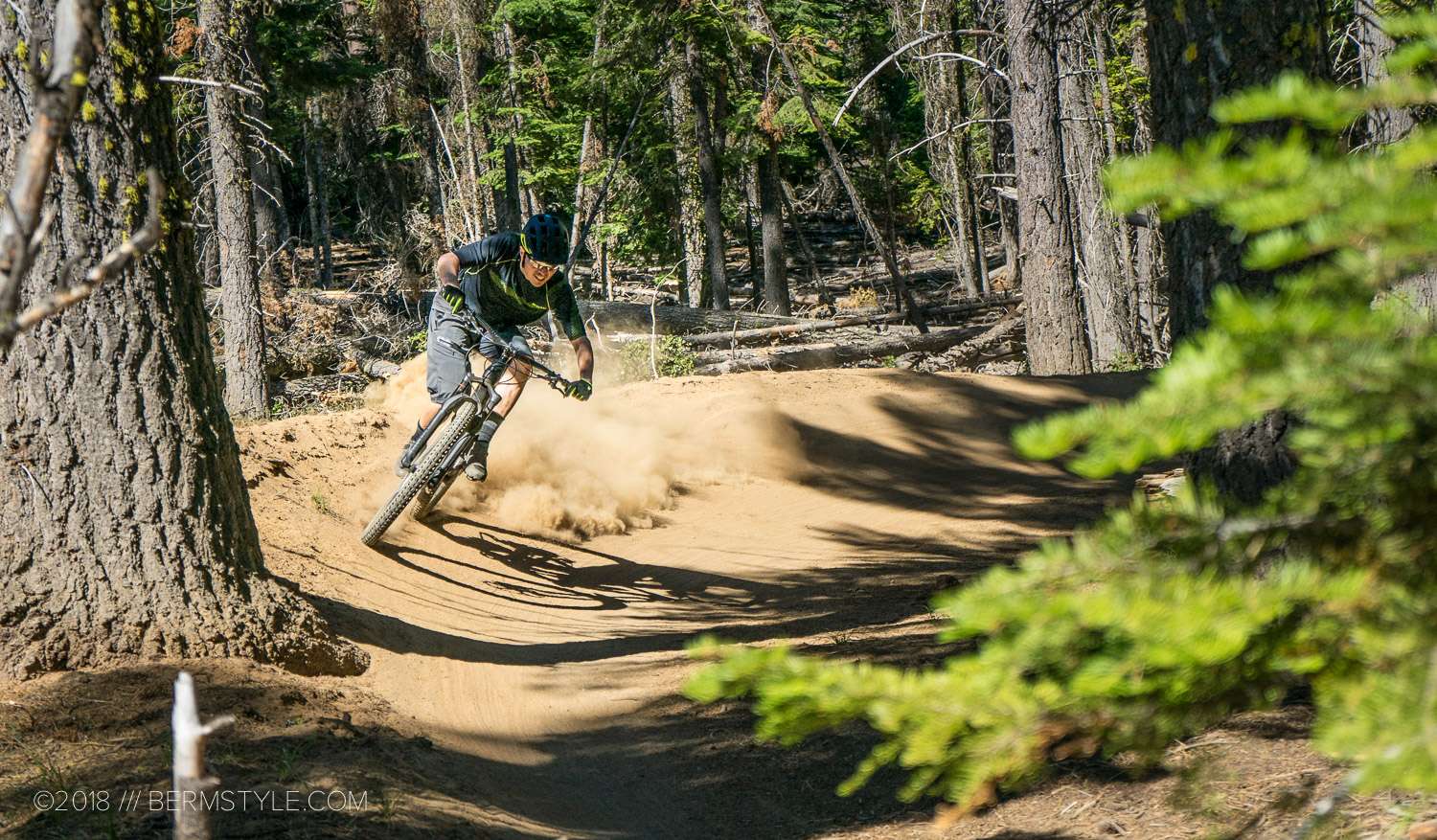 Mountain biker navigating a berm on a flow trail