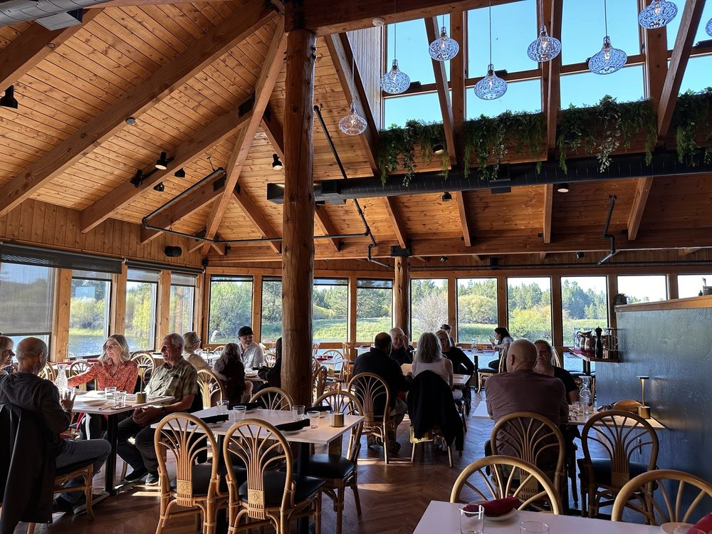 Outdoor dining with river views at sunset