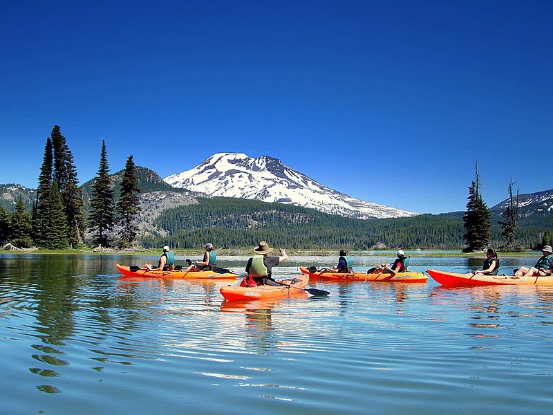 Kayaks on a calm mountain lake