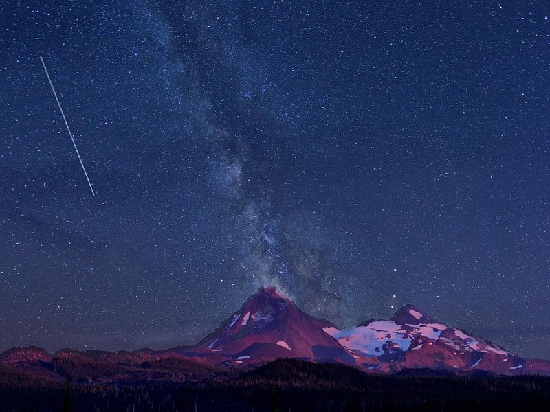 Starry Milky Way over a mountain silhouette